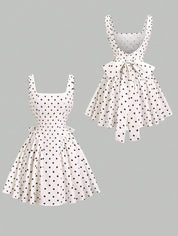Dames mini zomerjurk mouwloos met stippen en V-hals