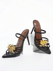 Dames sandalen met hoge hak en gouden bloemenapplicatie
