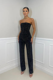 Dames zwarte glitter jumpsuit met mouwloze top en wijde pijpen