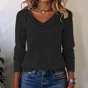 Dames top met gedrapeerde en lange mouwen