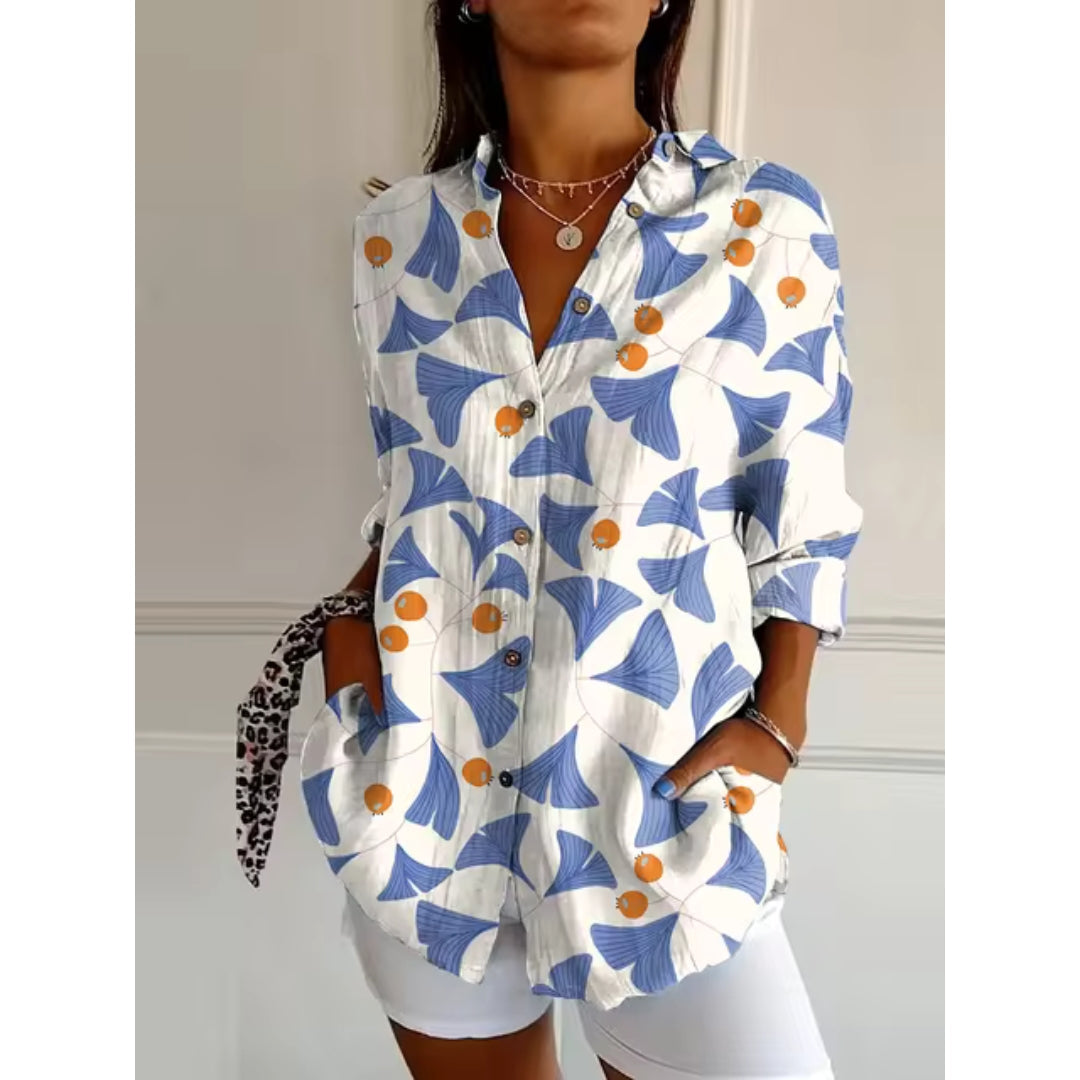 Women's mid-length blouse with floral print and button closure