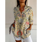 Women's mid-length blouse with floral print and button closure