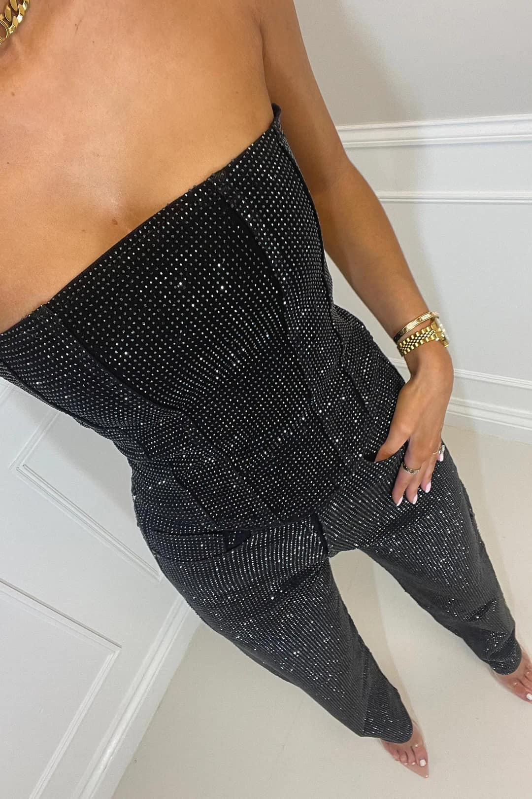 Dames zwarte glitter jumpsuit met mouwloze top en wijde pijpen