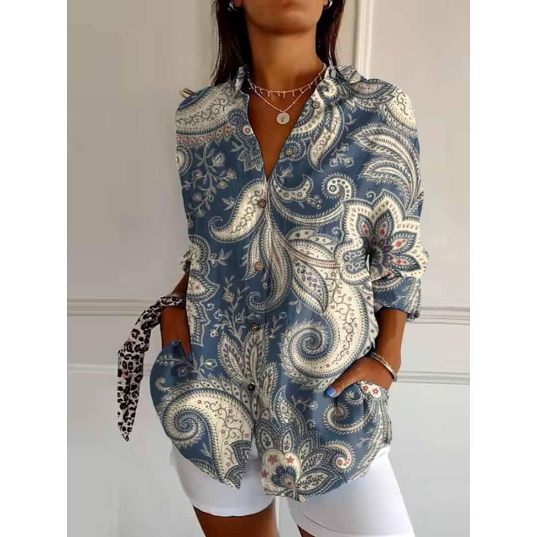 Women's mid-length blouse with floral print and button closure