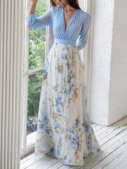 Dames zomerjurk blauw en bloemenprint met diepe v-hals