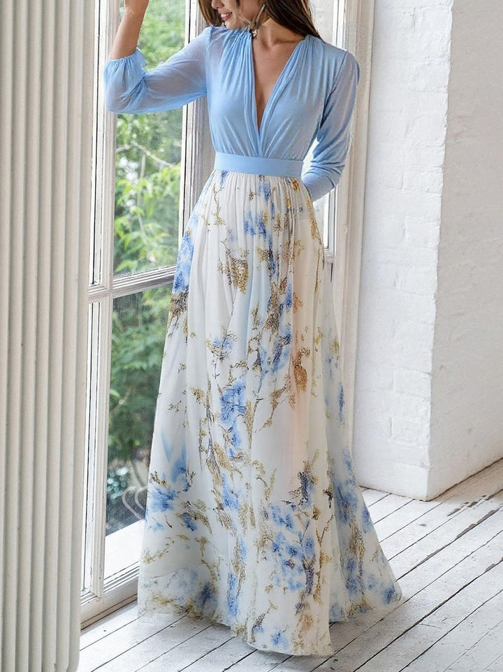 Dames zomerjurk blauw en bloemenprint met diepe v-hals