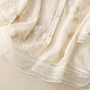 Dames blouse met bloemenborduursels en wijde pasvorm