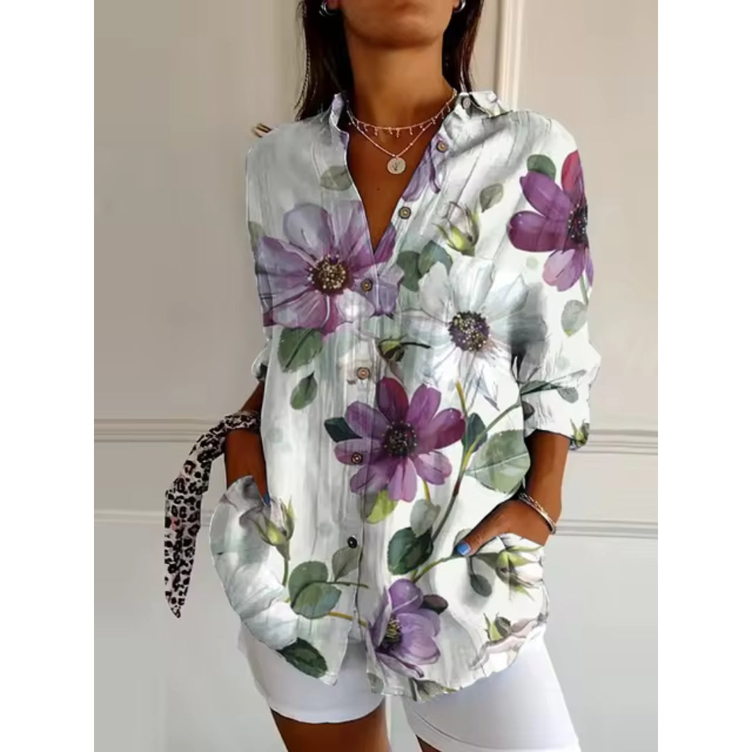Women's mid-length blouse with floral print and button closure