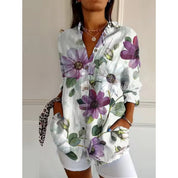 Women's mid-length blouse with floral print and button closure