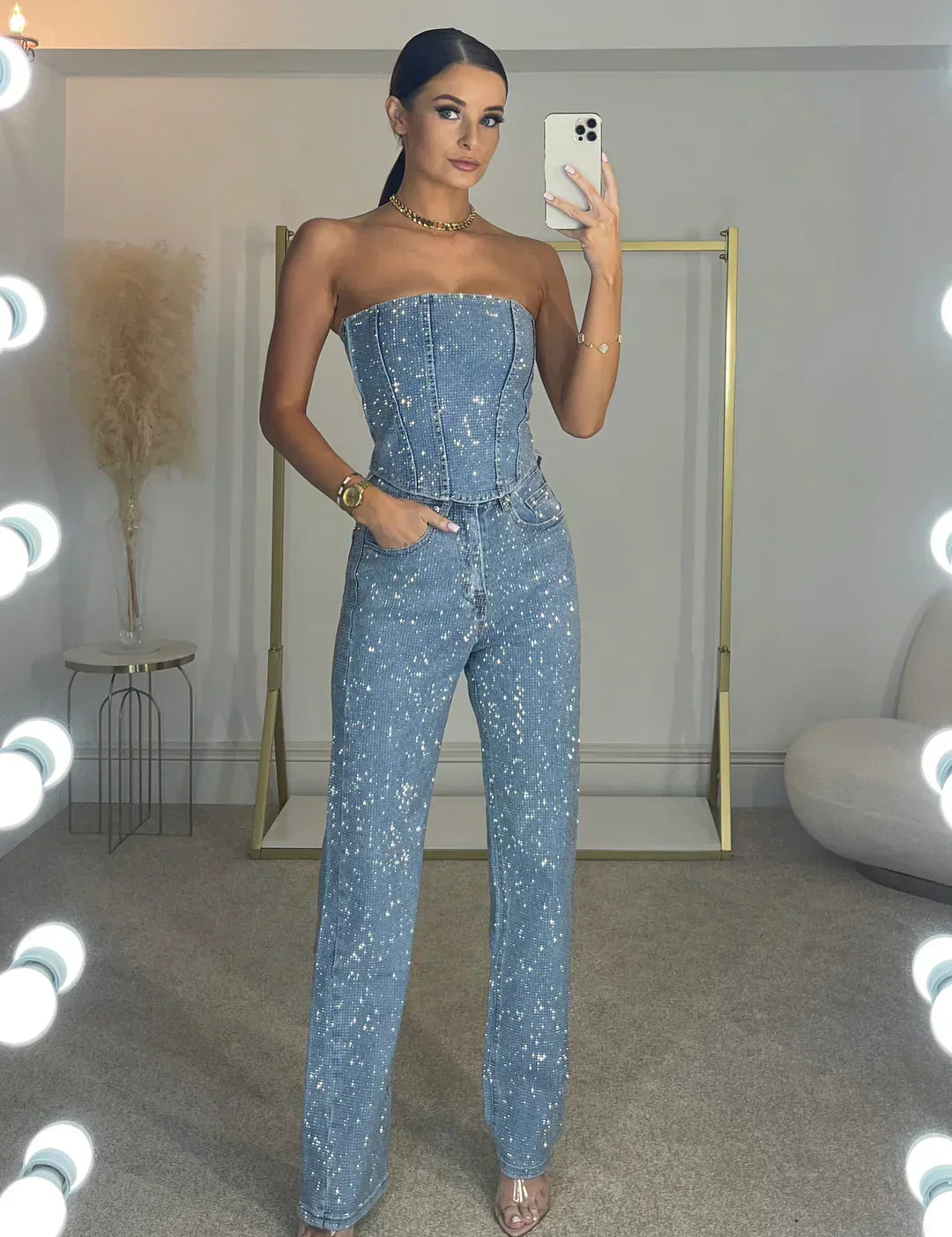 Dames zwarte glitter jumpsuit met mouwloze top en wijde pijpen