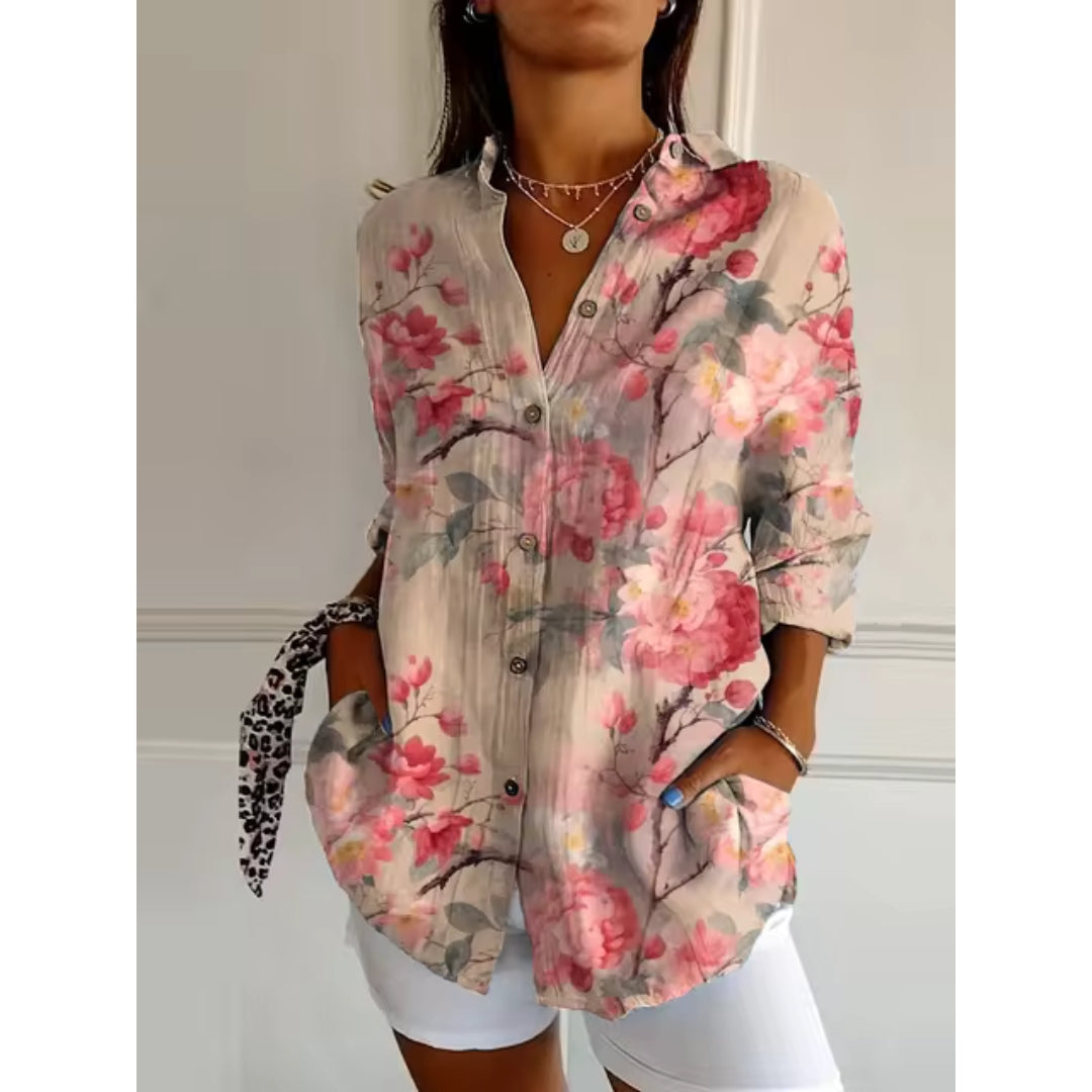Women's mid-length blouse with floral print and button closure