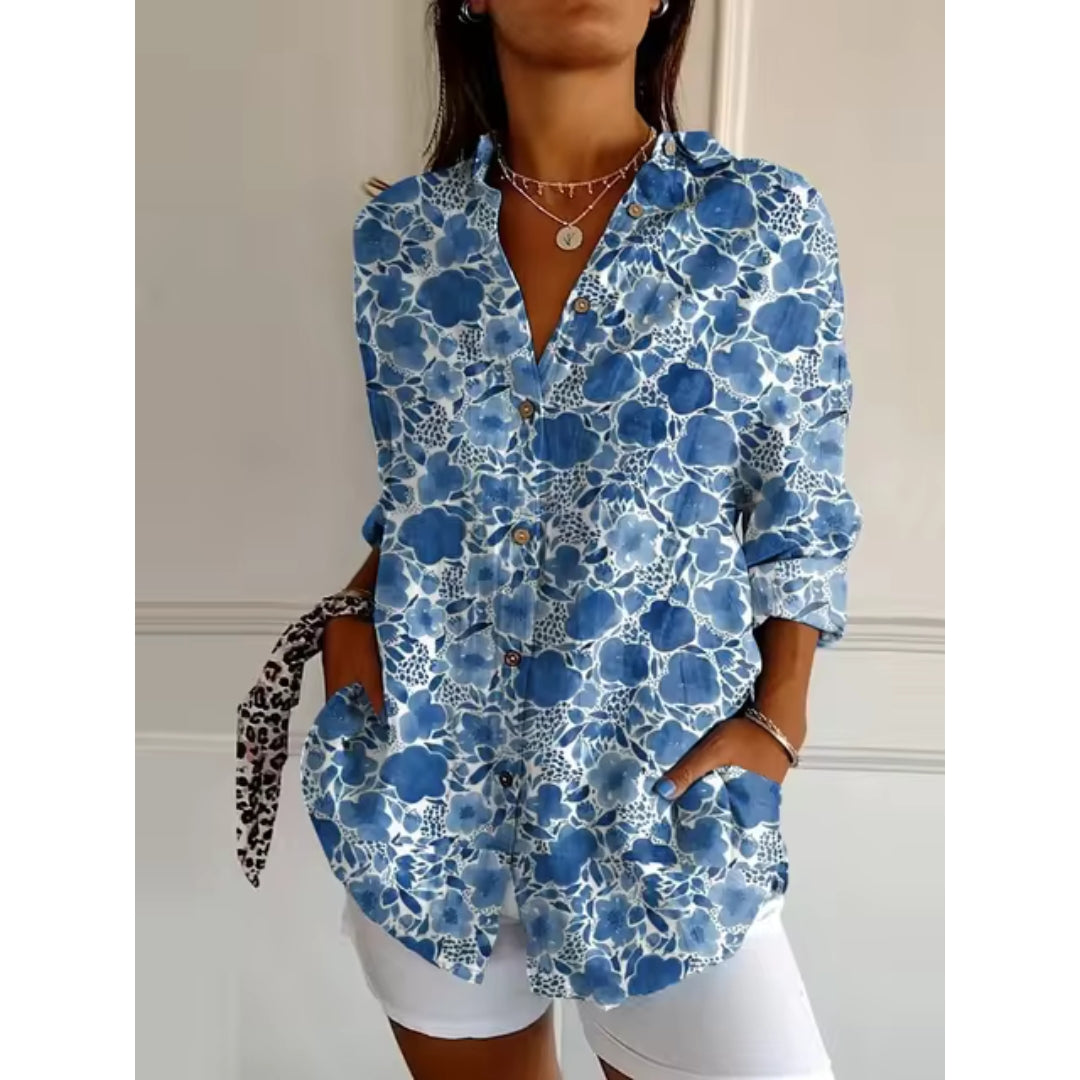 Women's mid-length blouse with floral print and button closure
