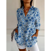 Women's mid-length blouse with floral print and button closure