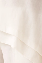 Women's white two-piece set with shirt and pants