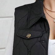 Dames bodywarmer met capuchon | Gewatteerd met zakken