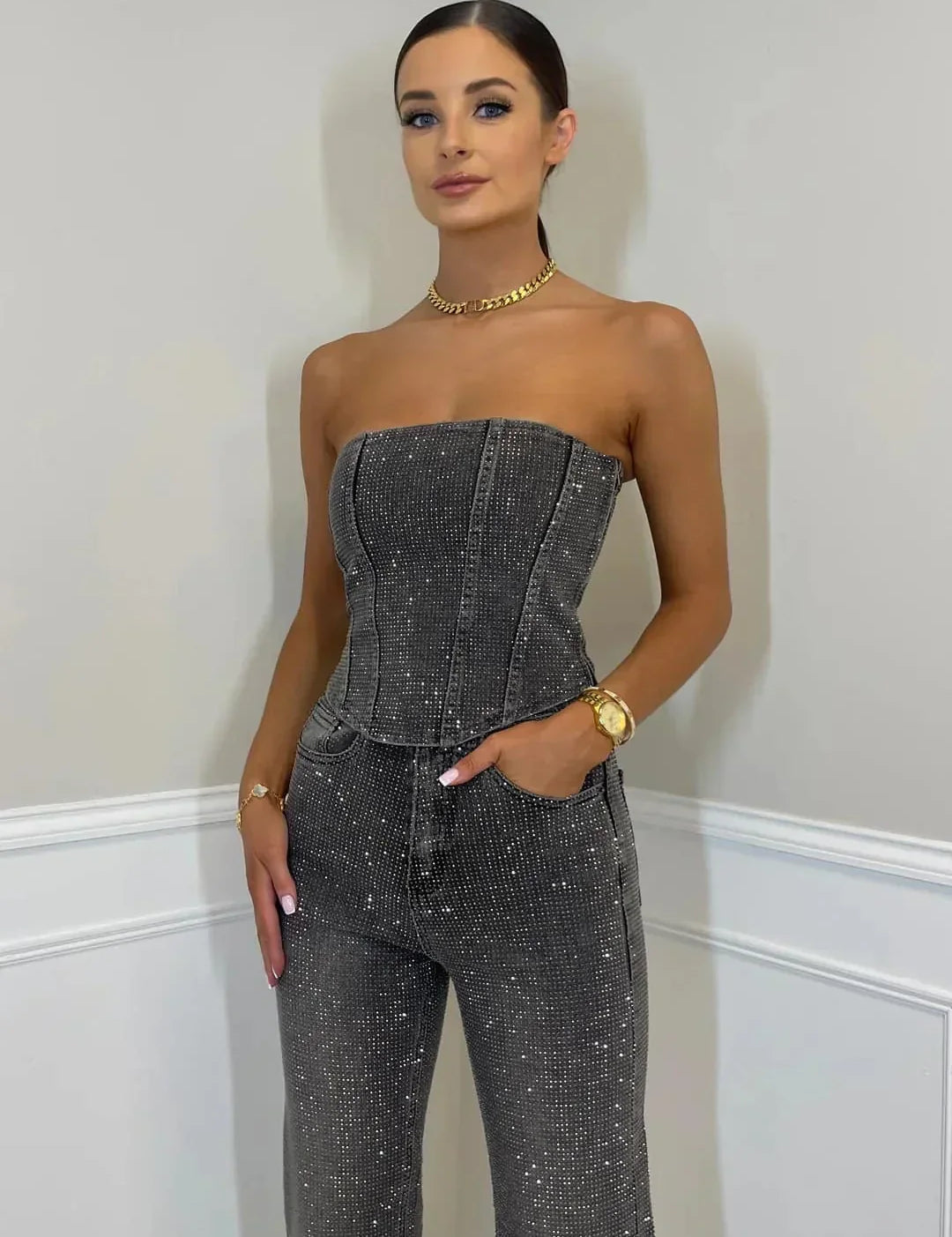 Dames zwarte glitter jumpsuit met mouwloze top en wijde pijpen