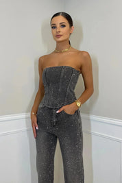 Dames zwarte glitter jumpsuit met mouwloze top en wijde pijpen