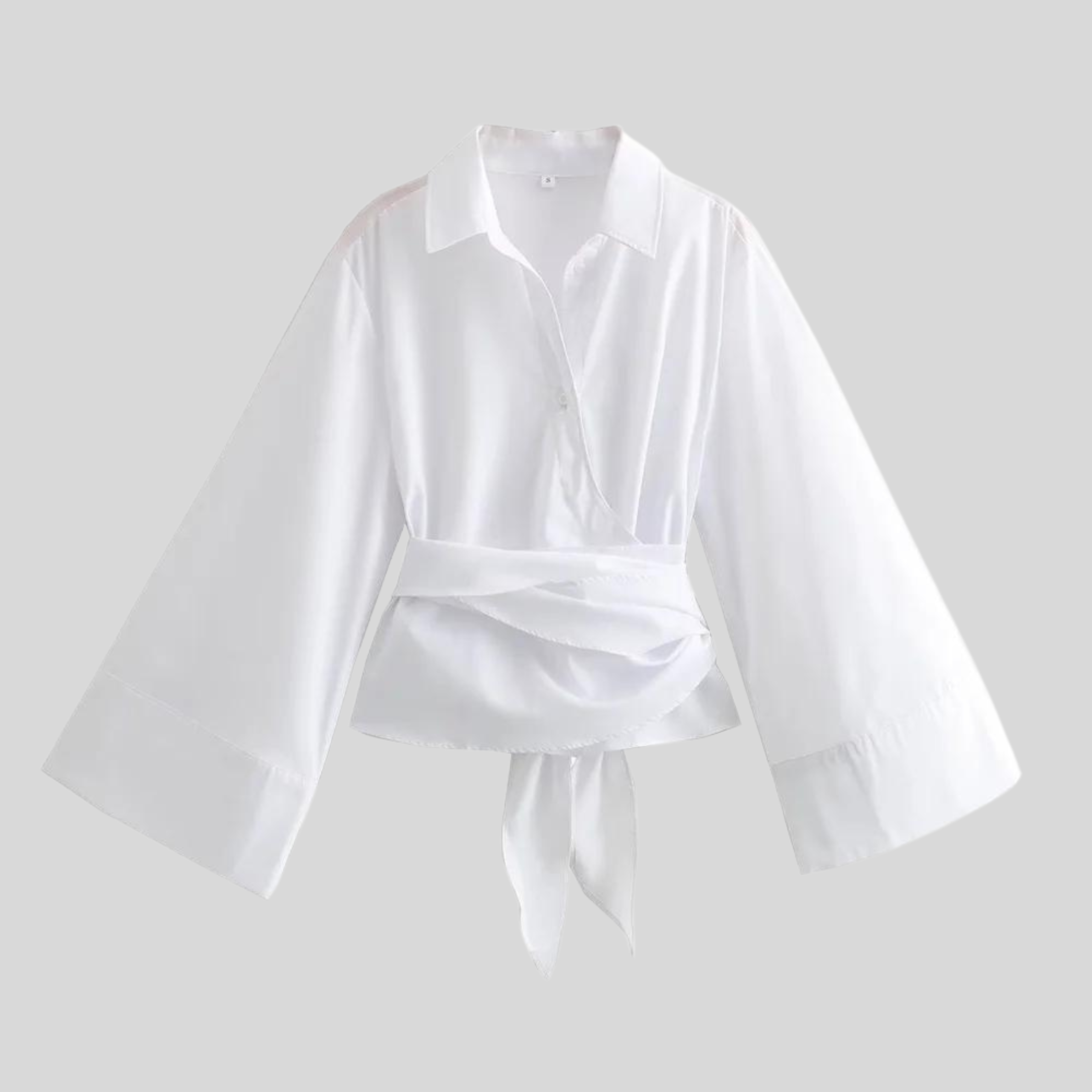 Women's top with elegant wrap detail in white or black
