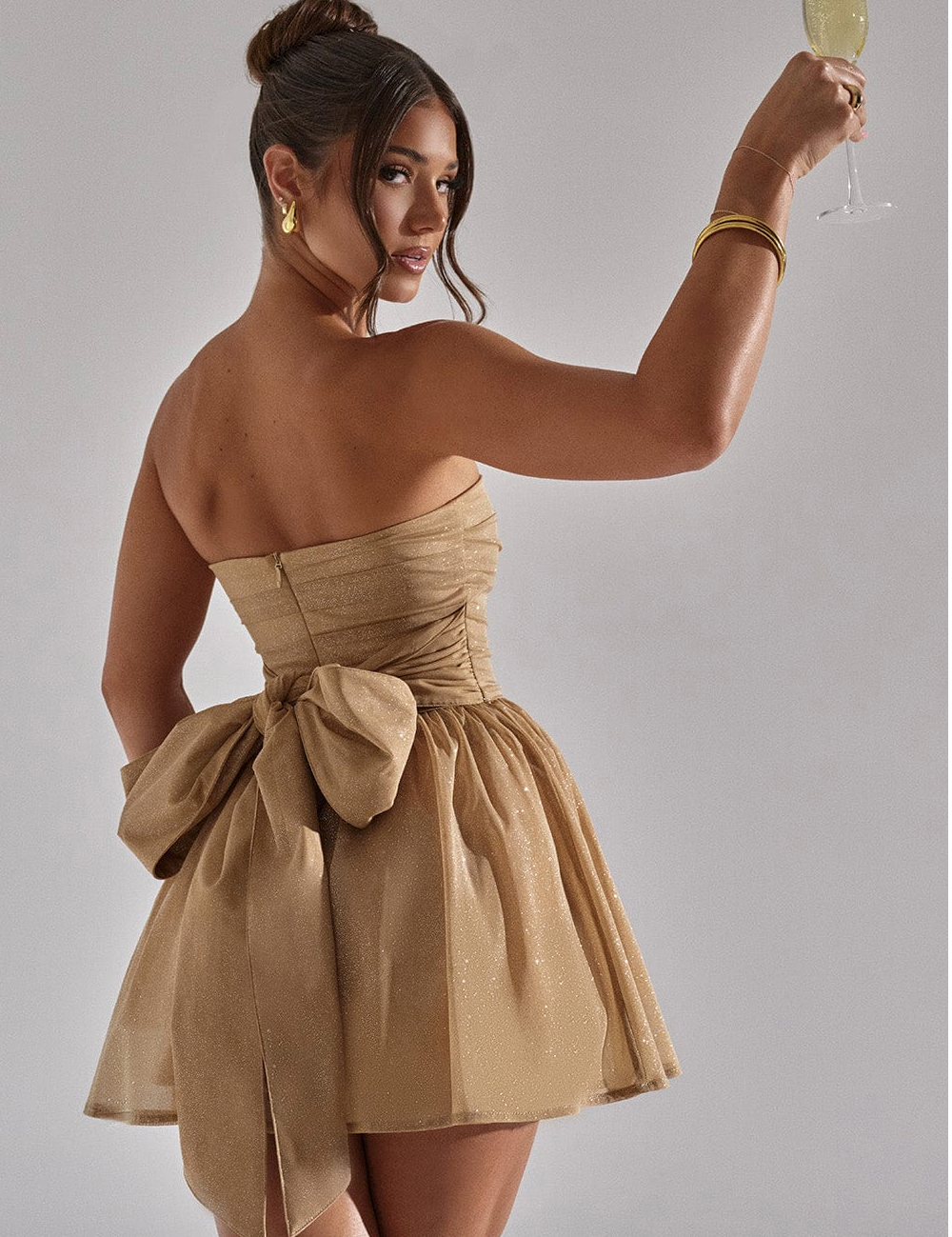 Feestelijke dames glitterjurk | Strapless en kort