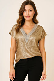 Women's gold blouse with V-neck and foil print short sleeves