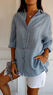 Women's blouse with button closure and classic collar