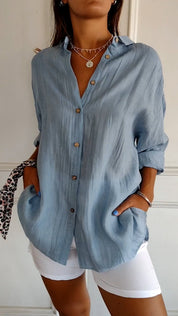 Women's blouse with button closure and classic collar