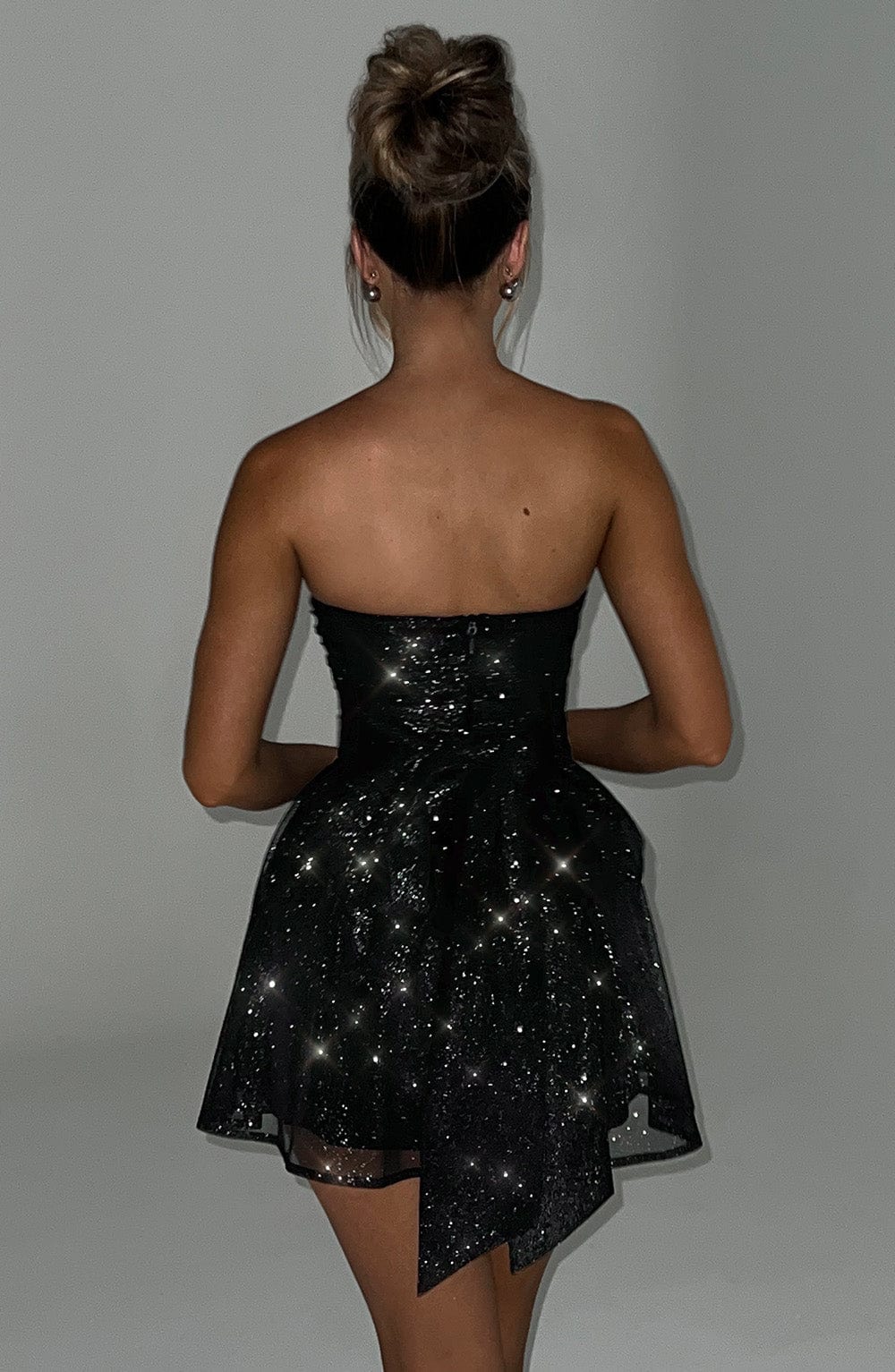 Feestelijke dames glitterjurk | Strapless en kort