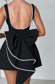 Dames cocktailjurk met strik detail en pareltjes - Avondjurk