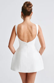 Dames cocktailjurk met strik detail en pareltjes - Avondjurk