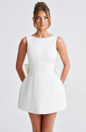 Dames cocktailjurk met strik detail en pareltjes - Avondjurk