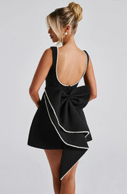 Dames cocktailjurk met strik detail en pareltjes - Avondjurk
