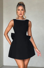 Dames cocktailjurk met strik detail en pareltjes - Avondjurk