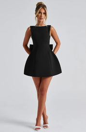 Dames cocktailjurk met strik detail en pareltjes - Avondjurk