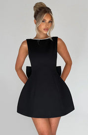 Dames cocktailjurk met strik detail en pareltjes - Avondjurk
