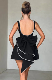 Dames cocktailjurk met strik detail en pareltjes - Avondjurk