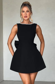 Dames cocktailjurk met strik detail en pareltjes - Avondjurk