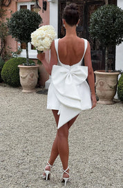 Dames cocktailjurk met strik detail en pareltjes - Avondjurk
