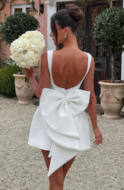 Dames cocktailjurk met strik detail en pareltjes - Avondjurk