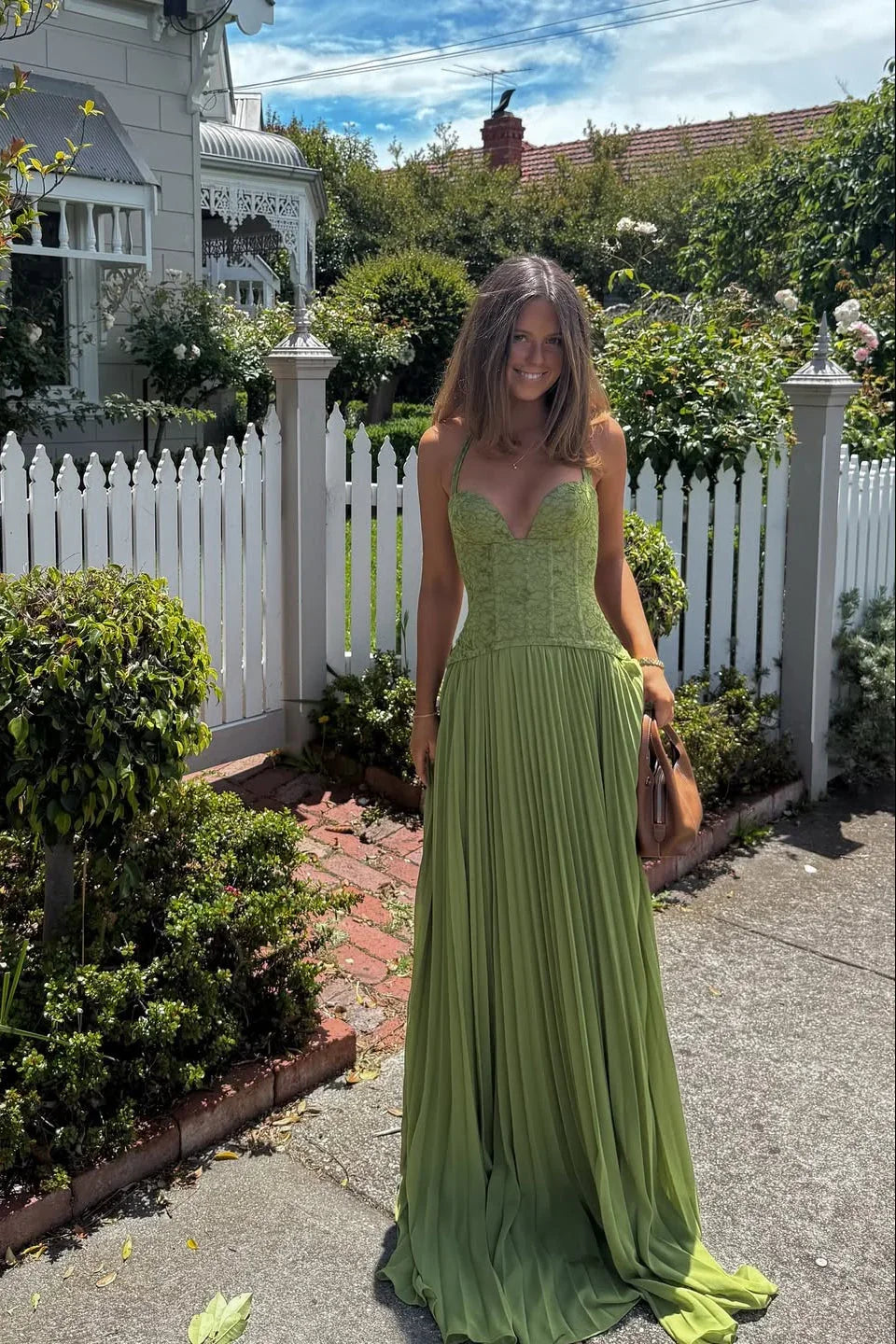 Groene feestjurk dames met corset en geplisseerde rok