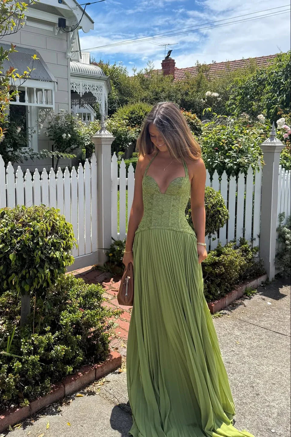 Groene feestjurk dames met corset en geplisseerde rok