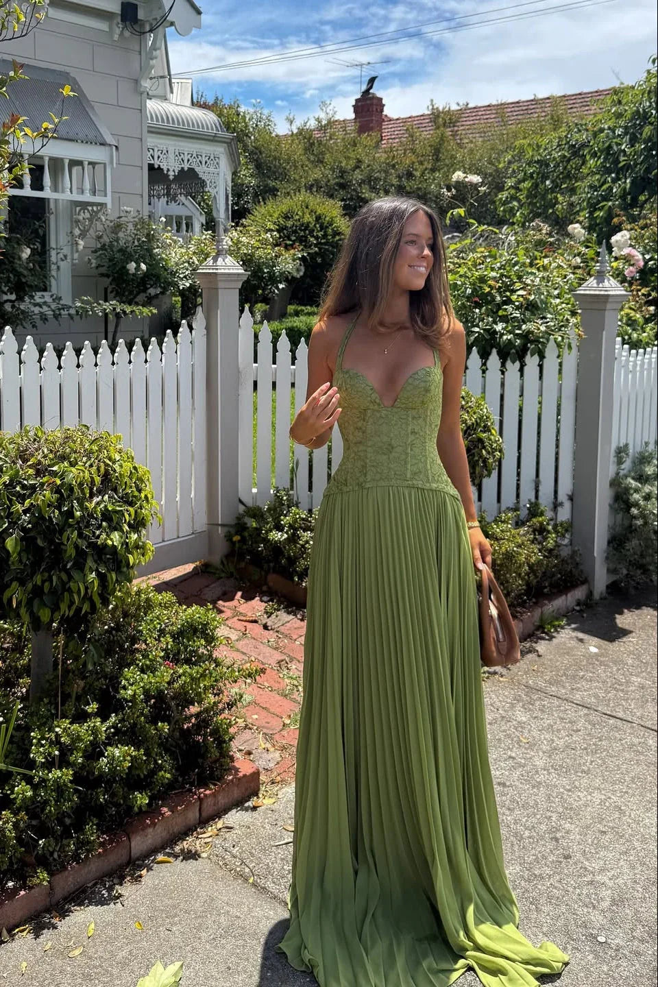 Groene feestjurk dames met corset en geplisseerde rok