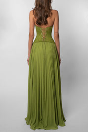 Groene feestjurk dames met corset en geplisseerde rok