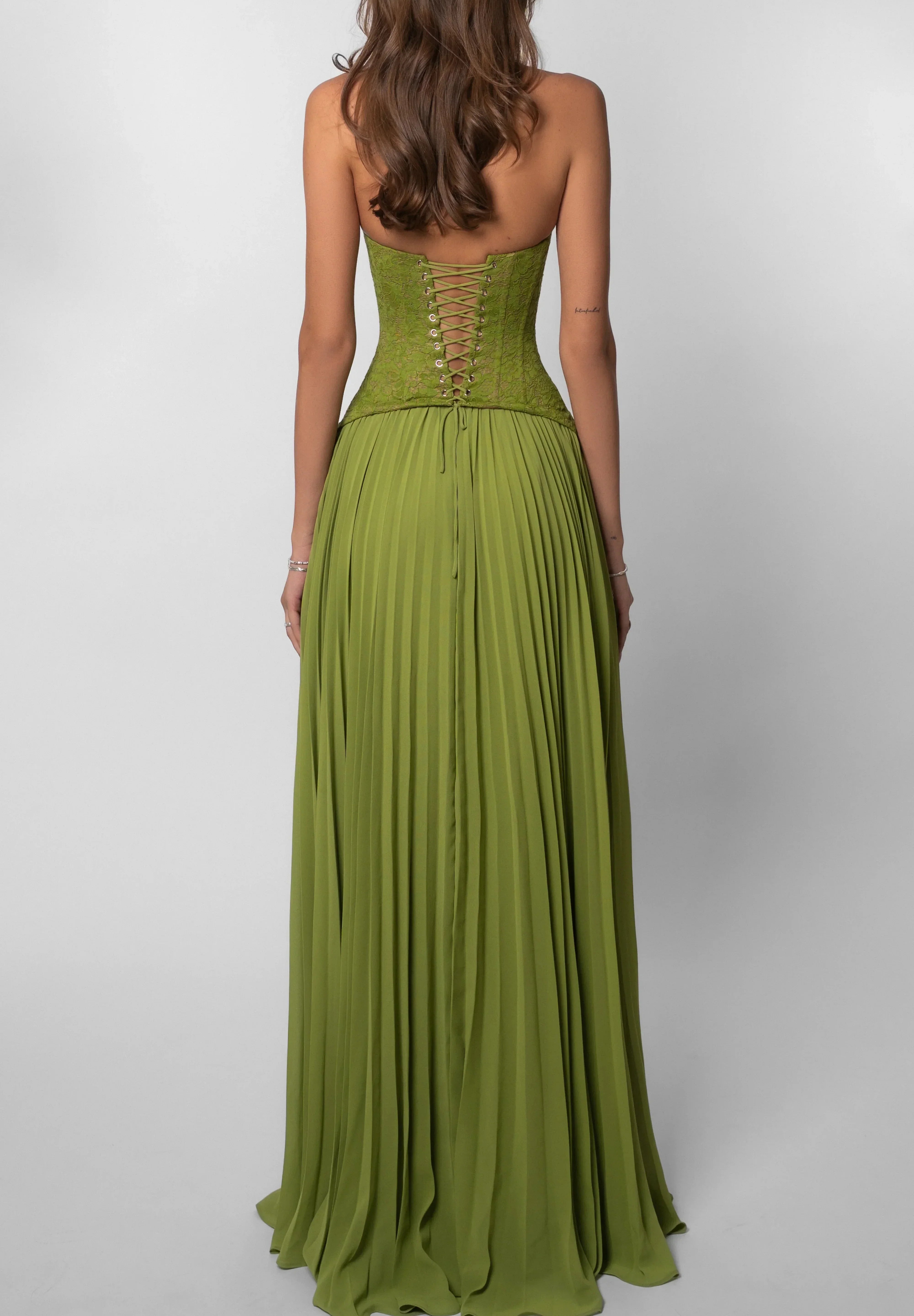 Groene feestjurk dames met corset en geplisseerde rok