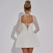 Dames feestelijke mini jurk met glitters en lange mouwen