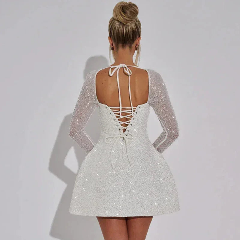 Dames feestelijke mini jurk met glitters en lange mouwen